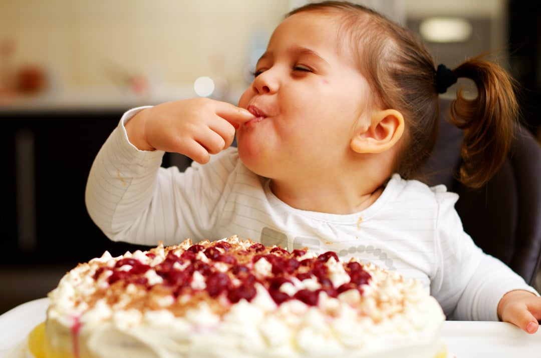 little-girl-eating-icing-cake